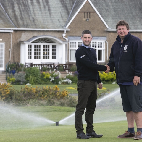 Deputy head greenkeeper Mathew Wormald, right, shakes hands with Reesink’s Peter Newton at Ganton Golf Club.