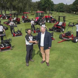 Course manager Luke Dennis shakes hands with Reesink’s Jon Lewis.