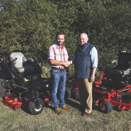 Company director Martin Granger, left, shakes hands with Reesink’s Julian Copping.