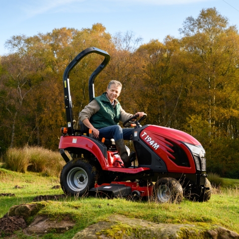 Director of Learning Fields, Alex Chalmers, with the TYM T194 tractor that has been used for mowing and transporting on the farm.