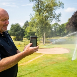 Course manager John Smith operating Toro’s Lynx central control system from his phone.